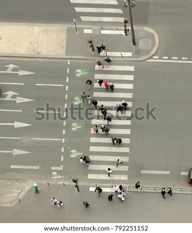 aerial view of people crossing the street on zebra. city scene