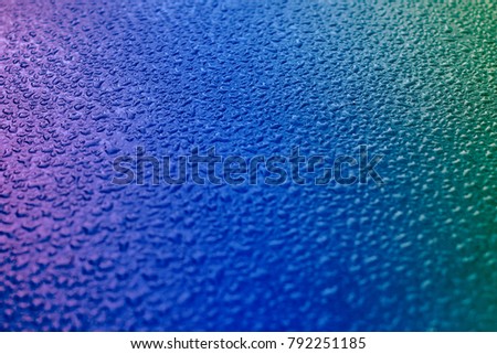 Wetted glass, water droplets, soft focus