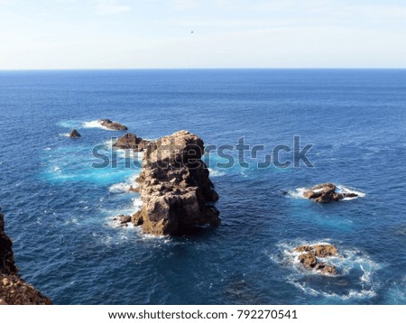 Rocky ocean picturesque seascape in blue and turquoise colours, Portugal, Algarve