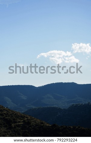 Image against sun of mountain landscape