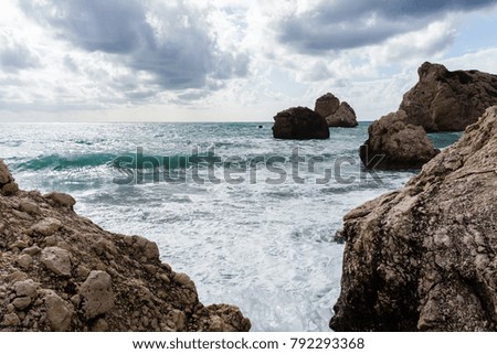 Photo of sea, rocks, gloomy cloudy sky