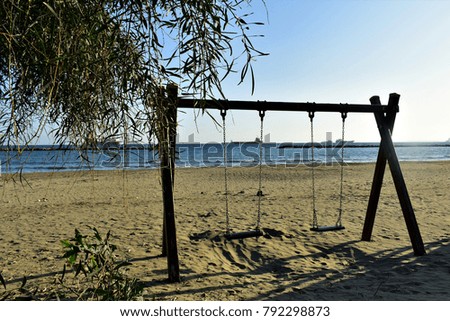 Swing on the empty beach, winter Cyprus. 