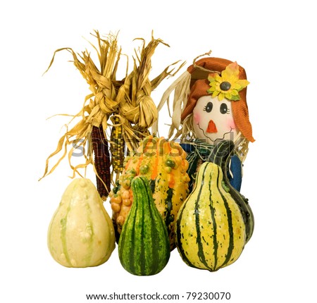 fall decoration- gourds, corn and handcrafted face on a white background