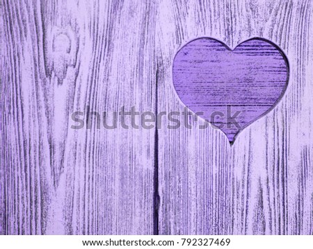 blue heart carved in a wooden board. Background. Postcard, valentine.