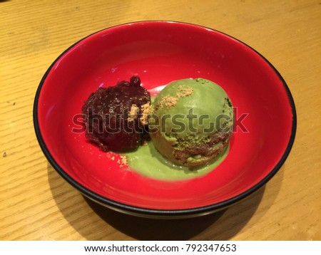 Green tea ice cream wih sweet red bean in japanese style red bowl