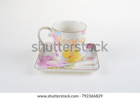 beautiful cup with flowers and saucer