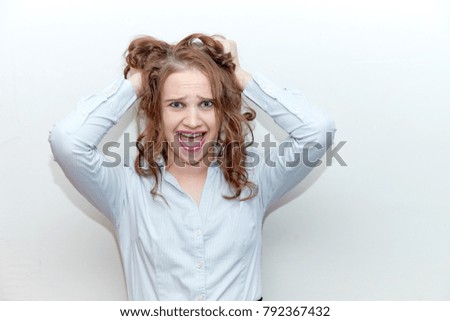 cute girl teacher at the blackboard on a white background smiling, live emotions