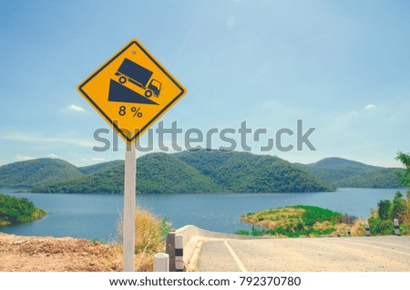 Signs mark the slope of the road to keep the car carefully.