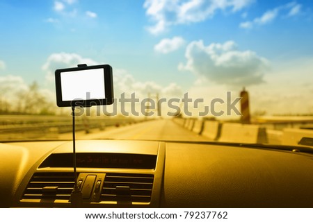 GPS navigation system on a car dashboard. Useful file for your brochure about security, travel and other transportation services. Blank display to fill your data in
