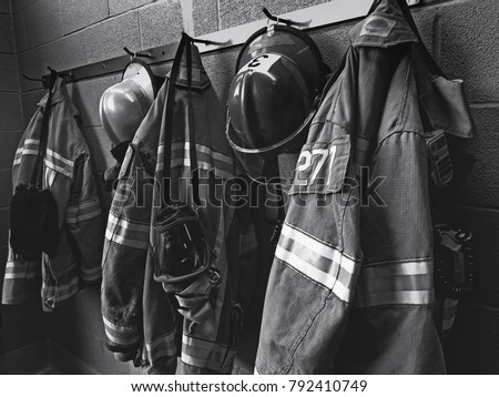 Firefighter gear with fire hoses and truck