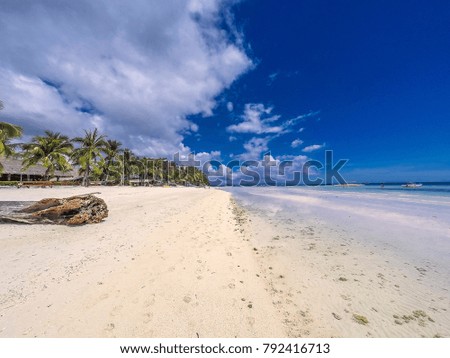 tropical white sand beach and blue sky