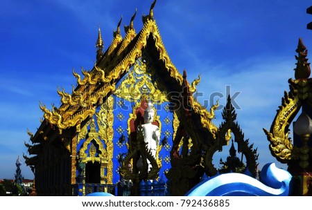 the outdoor wall and the roof of the Northern Thai  temple are decorated with colorful patterns of  the serpent fine art,it is needed to be visited this place ,Wat Rong Sua Ten,ChiangRai,Thailand