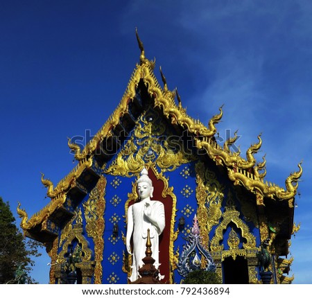 the outdoor wall and the roof of the Northern Thai  temple are decorated with colorful patterns of  the serpent fine art,it is needed to be visited this place ,Wat Rong Sua Ten,ChiangRai,Thailand