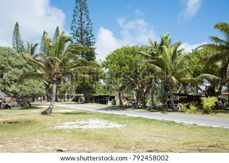 TADINE,MARE/NEW CALEDONIA - DECEMBER 3, 2016: People resting and exploring around Yejele beach with lush, tropical flora in Mare, New Caledonia Royalty-Free Stock Photo #792458002