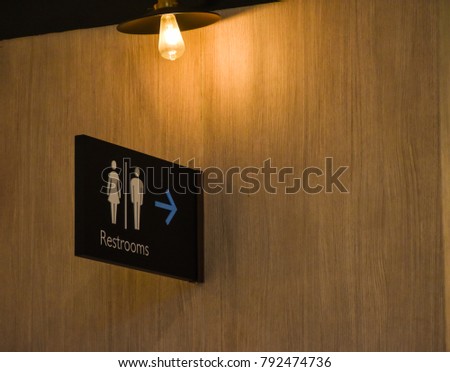 Toilet Sign. Restroom Concept On Wood Background. Public Restroom Symbol. Selective Focus. Image For Templates, Placards, Banners, Presentations, Reports, Card And Wallpaper. etc