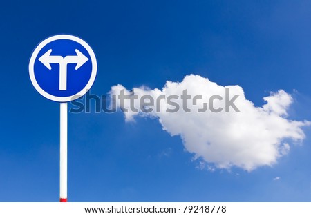 Curved Road Traffic Sign over blue sky,turn left