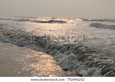 A Out of Focus image of Sun reflection on the sea waves. 