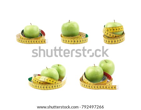 Green apple fruit tied with the dieting measuring tape, composition isolated over the white background, set of five different foreshortenings