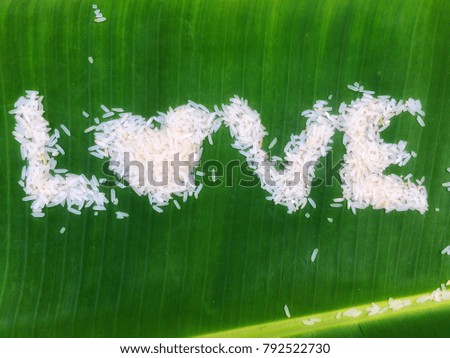 Rice on green banana leaf in the word LOVE.