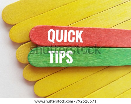 Concept image of colorful ice cream sticks and word - QUICK TIPS with white background  