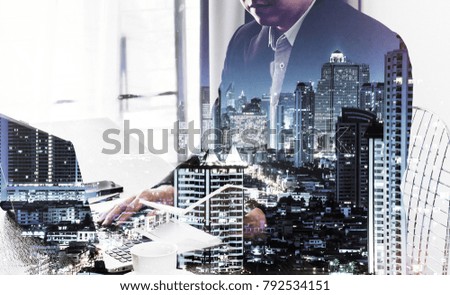 Double exposure of success business man city background.