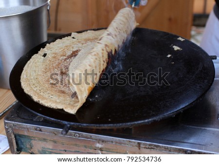 Pancakes - Palachinka, Palatschinke or palacsinta is a thin crepe - variety of pancake. Palatschinke are thin pancakes similar to the French crepes. Pictures through steam from pancakes. 