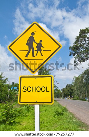 Traffic sign (School warning sign) and blue sky.