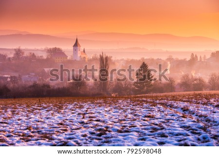 Church in colorful winter morning. Warm scenery, rural landscape. Christian, faith, pray romantic concept photo with edit space