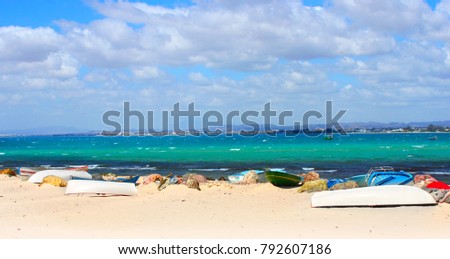  Tropical beach with fishing boats in Tunisia