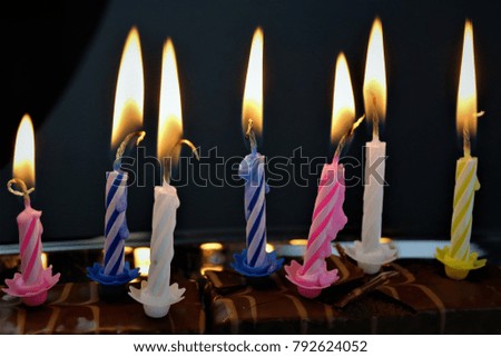 An concept Image of some candles at a children birthday party