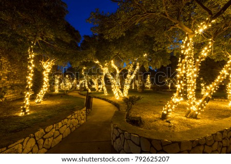 christmassy decorated trees in a park on island rab, croatia