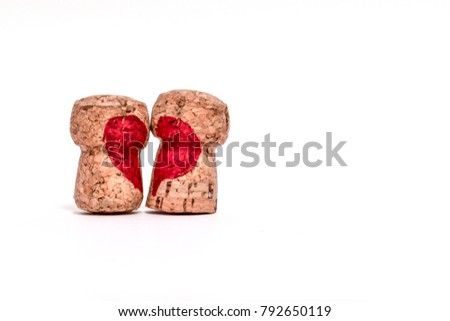 Two corks with red heart shape painting and put on the right on white background. Concept Valentine's day and Love forever.