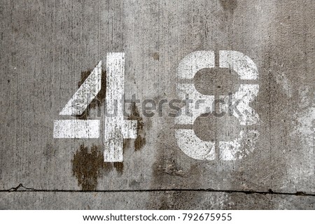 48 forty eight number stencil concrete parking wall white paint