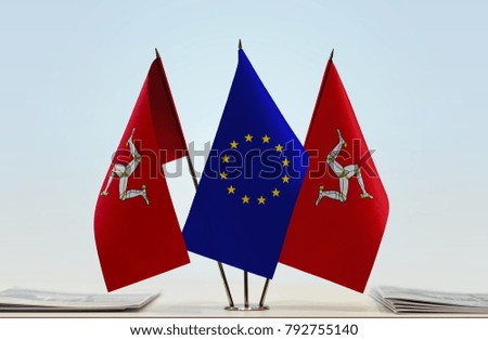Two flags of Isle of Man and European Union flag between