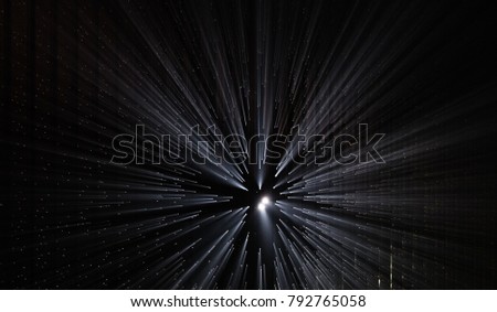 Light rays through small holes in a dark metal space Royalty-Free Stock Photo #792765058