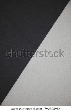 Abstract artistic background: a mixture of black and white diagonally.