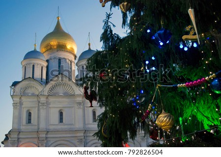 Archangels church of Moscow Kremlin. Christmas and New Year 2018 tree on Sobornaya square. Popular touristic landmark. Color photo.