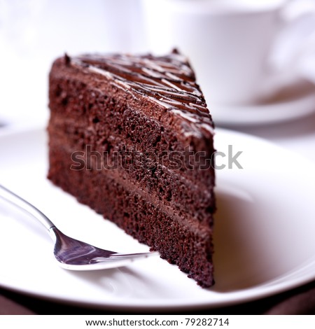 A slice of delicious chocolate cake. Piece of Cake on a Plate. Sweet food. Sweet dessert. Close up.   Royalty-Free Stock Photo #79282714