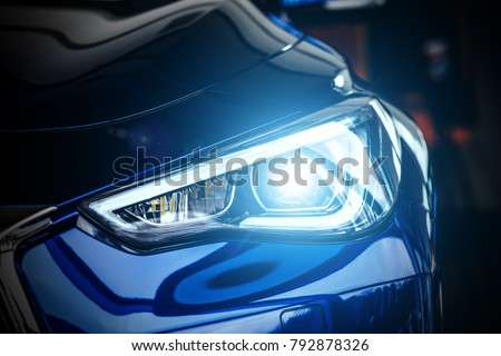 Macro view of modern blue car xenon lamp headlight Royalty-Free Stock Photo #792878326