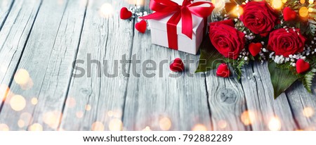 Valentines Card - Giftbox And Roses On Wooden Table With Lights
