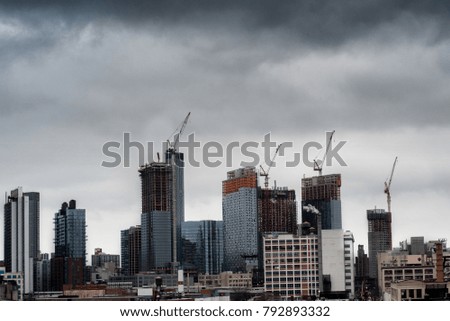 New York City east side skyline showing construction on a cloudy day