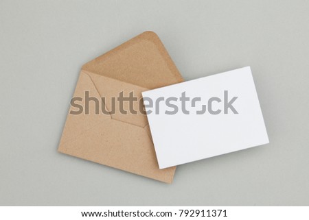 Blank white card with kraft brown paper envelope template mock up Royalty-Free Stock Photo #792911371
