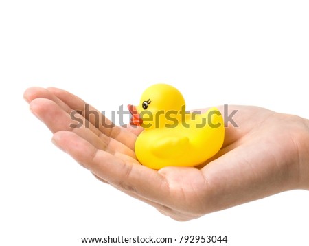 A duck in the hand, feel like a comfortable of care. Picture in care and safe feeling concept.