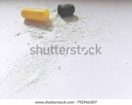 Drug capsule on white background