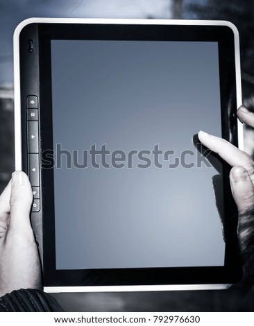 closeup. female hand clicking on a point on the screen of the digital book