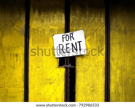 Photo of a For Rent sign on a door of a stall