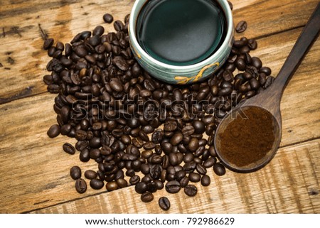 Coffee beans with good taste.and cup on the table