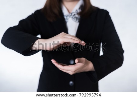 Businesswomen standing posture show hand on over gray background