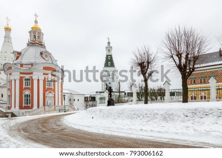 Road in the park with orthodox churches, winter landscape