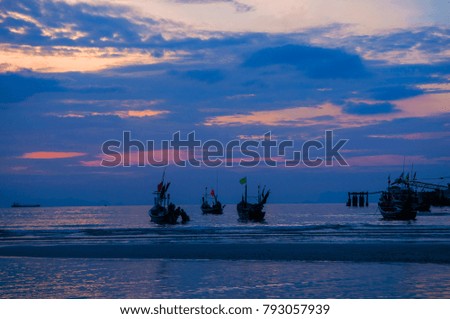 thai long tail boat in the Andaman Sea on background of beautiful sky clouds with evening sun